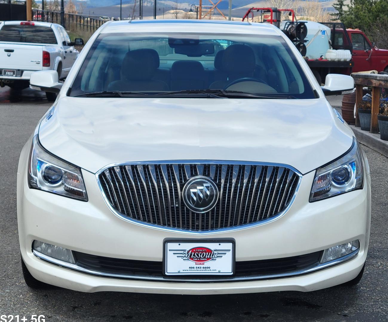 2014 Pearl White /Brown Buick LaCrosse PREMIUM (1G4GE5G33EF) with an 3.6L V6 engine, 6 Speed Auto transmission, located at 450 N Russell, Missoula, MT, 59801, (406) 543-6600, 46.874496, -114.017433 - Beautiful AWD Luxury Sedan. 3.6L V6 Engine. 6 Speed Automatic Transmission. Power Sunroof. Leather Heated Seats. Bluetooth. Memory Seats. Air. Cruise. Tilt. Power Windows and Locks. AM FM XM CD. Bose Sound. Remote Start. Adaptive Cruise Control. - Photo#2